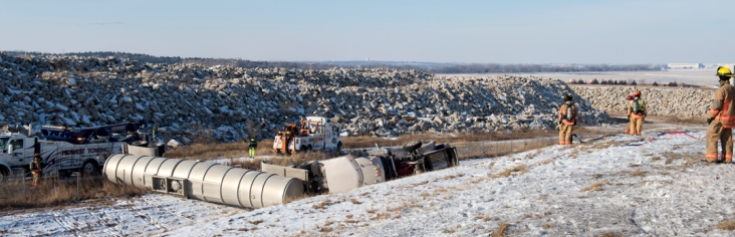LINCOLN, NEB. - 01/04/2018 - Firefighters work with Midwest Towing to overturn a tanker carrying ethanol near the I-80 southbound 77 interchange Thursday, Jan. 4, 2018. The driver suffered minor injuries. KAYLA WOLF, Journal Star