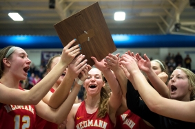 LINCOLN, NEB. - 01/27/2018 - Bishop Neumann's Jessina Rada (center) and her teammates grab the conference championship plaque after defeating St. Cecilia on Saturday, Jan. 27, 2018, at Lincoln Christian High School during the Centennial Conference tournament final. Bishop Neumann defeated St. Cecilia 45 to 35. KAYLA WOLF, Journal Star