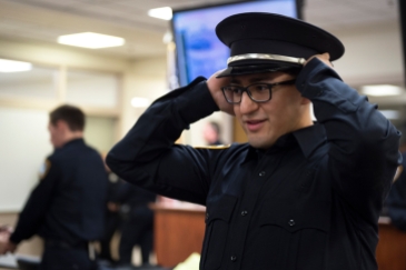 LINCOLN, NEB. - 01/08/2018 - Lincoln Police Department recruit Austin Espinoza tries on a hat Tuesday, Jan. 9, 2018, at the City Government Complex. Recruits were fingerprinted, photographed and fitted for uniforms. KAYLA WOLF, Journal Star
