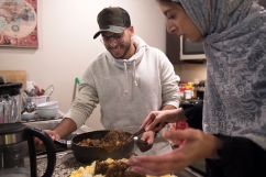 LINCOLN, NEB. - 01/12/2018 - Said Al Barumi (left) and Amira Al Harthy finish preparing dinner Friday, Jan. 12, 2018, at Al Harthy's apartment in downtown Lincoln. KAYLA WOLF, Journal Star