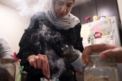 LINCOLN, NEB. - 01/12/2018 - Following dinner Friday, Jan. 12, 2018, Amira Al Harthy heats frankincense and other resins to freshen the aroma of her apartment in downtown Lincoln. KAYLA WOLF, Journal Star